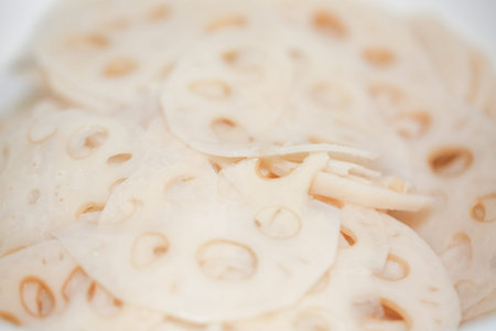 Slices of fresh lotus root on white background - isolated (Asian ingredients) - Imageの写真素材