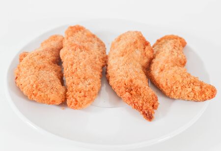 Delicious crispy fried breaded chicken breast strips . - Imageの写真素材
