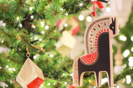 Decorated Christmas tree with colored noel ball with blurred background.- Imageの写真素材