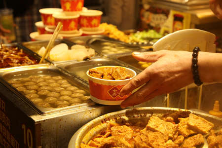 A market store selling beancurds and other street foodsのeditorial素材