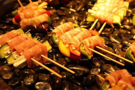 many prawns in bacon bbq sticks on grill, outdoor, summer bbq timeの写真素材