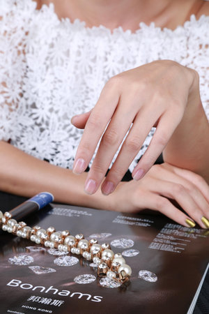 Close-up of a woman's hand and a braceletのeditorial素材