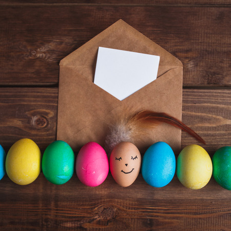 Colorful Easter eggs on rustic wooden background. Easter greeting cardの写真素材