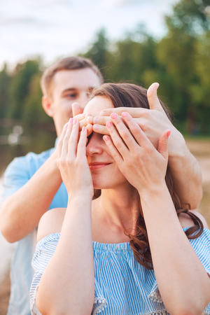 Marriage proposal on sunset . young man makes a proposal of betrothal to his girlfriendの写真素材