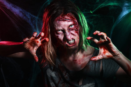Close-up portrait of horrible zombie woman with wounds. Horror. Halloween poster.