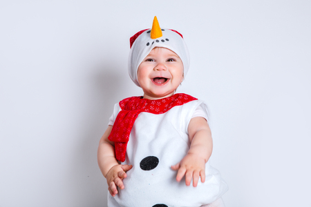 merry christmas and happy new year. happy baby in snowman costumeの写真素材