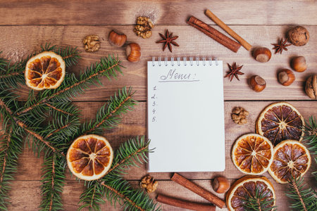 Christmas cookies, spices and recipe book. Food background. Vintage style picture
