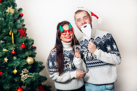 Couple with funny christmas masksの写真素材