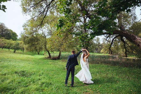 wedding dance . Just married couple dancing outdoorの写真素材