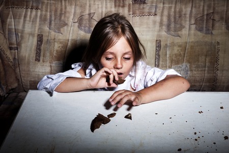 Child abuse. Poor child in slum begging you for help concept for poverty or hunger people,の写真素材