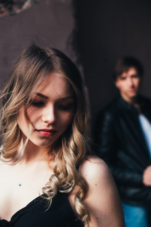 portrait of a beautiful couple walking in the street in summer