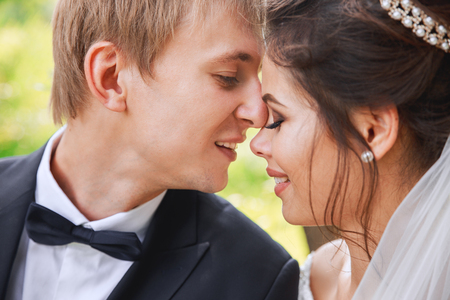 Sensual portrait of a young couple in park. Wedding photo outdoorの写真素材
