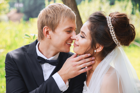 Sensual portrait of a young couple in park. Wedding photo outdoorの写真素材