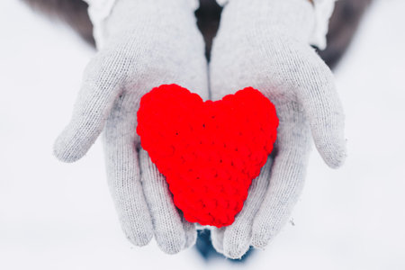 emale hands giving red heart. Health care, love and family insurance concept, world heart day, world...