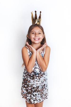 Beautiful little princess. Birthday party for cute child.の写真素材