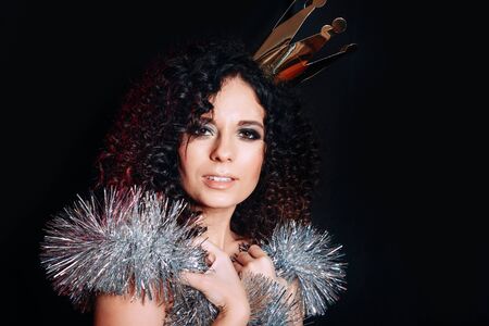 sexy celebrating woman gold Crown laughing , posing on black background.の写真素材