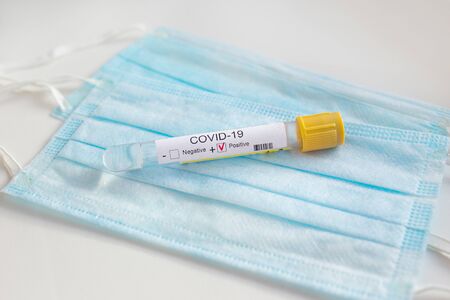 Coronavirus test and protective mask on white background. Covid 19 nestの写真素材