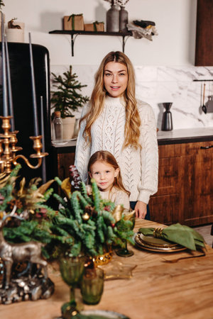 Happy family in kitchen helping to prepare Christmas dinner togetherの写真素材
