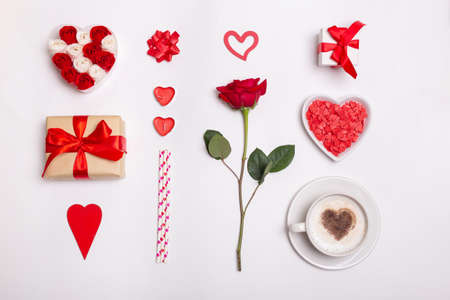 Valentines day minimal concept with heart shape, gift box , candles, rose and coffee cup. Valentines Day background.の写真素材