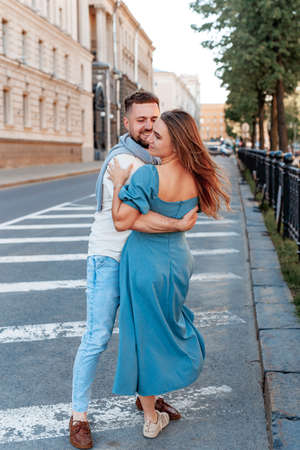 Romantic couple dancing in the street on a sunny summer day in cityの写真素材