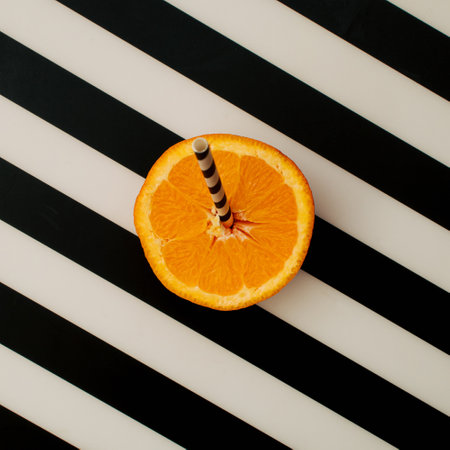 Fresh orange on black and white background. Creative ideas foe healthy, organic food.の写真素材