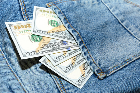 Dollar banknotes in jeans back pocketの写真素材