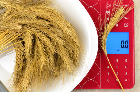 Dish of cereals on electronic kitchen scales. On the screen  0 kcalの写真素材