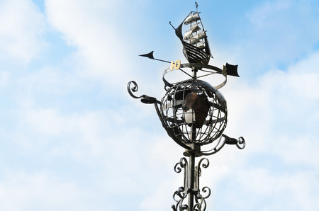 Street lamp in the form of a globe on the sky backgroundの写真素材