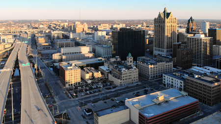  Aerial view of american city at dawn. High-rise  buildings, freeway, bay.  Sunny morning. Milwaukee, Wisconsin, USA
のeditorial素材