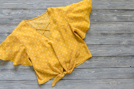 Womens clothing (yellow blouse in polka dot). Fashion outfit. Shopping concept. Flat lay. Trendy color. Spring summer collectionの写真素材