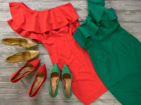 Womens clothes and shoes (Red green dresses, pumps). Fashion outfit for christmas, evening, night out. Template for online store, website, banners. Flat lay, top down viewの写真素材