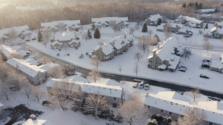 Aerial view of residential houses, condo, townhouses covered snow at winter season. Establishing...