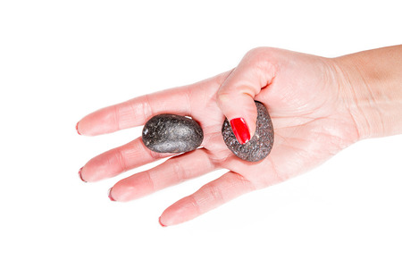 female hands holding a stones, spa themeの写真素材