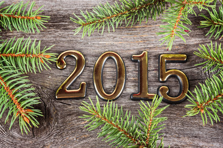 New Year frame with  fir decorations on old wooden background