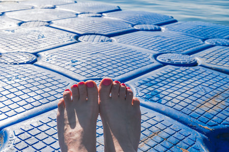 feet on the pontoon on a hot summer day, Egypt,Red sea
