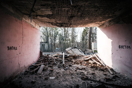 Shabby abandoned house with cracked color paint. Interior of an old abandoned soviet barrack room.Old abandoned house entranceの写真素材