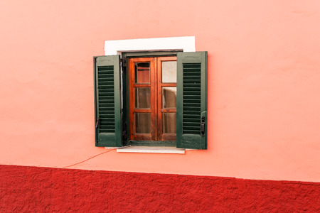 part of house in Corfu with a wooden green window.の写真素材