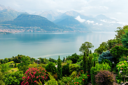 Como lake landscape, Laghetto di Piona  in Italy, Alps, Europe. Picturesque rural mountain landscape with trees and flowers.の写真素材