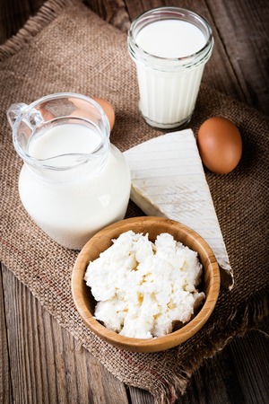 Tasty dairy products on rustic wooden tableの写真素材