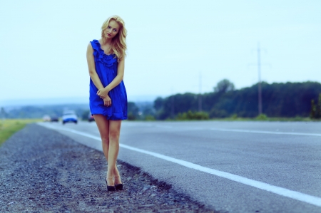 Lonely girl on the roadsideの写真素材