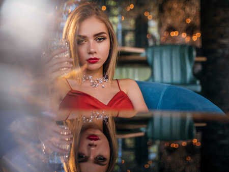 party photo of elegance sexy lady in red dress with red lipsの写真素材