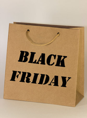 Black friday brown recycle shopping bag with handles on whiteの写真素材