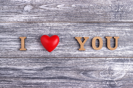 I love you, wooden with red heart lettering, gray wooden background, postcard Happy Valentine day, flat layの写真素材