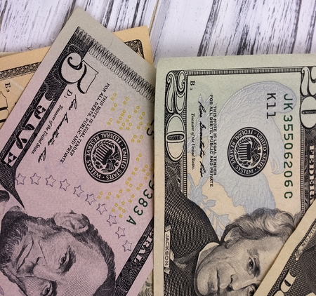 American dollars on old white wooden plankの写真素材