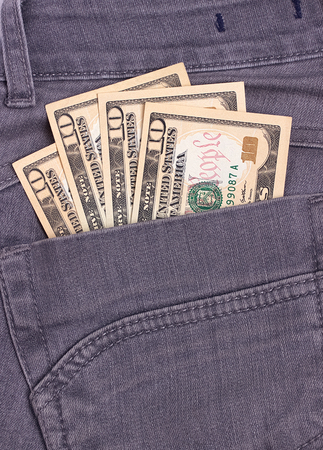 Dollars bills in black jeans back pocketの写真素材