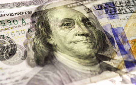 Benjamin Franklin face on US hundred or 100 dollars bill macro, united states money closeupの写真素材