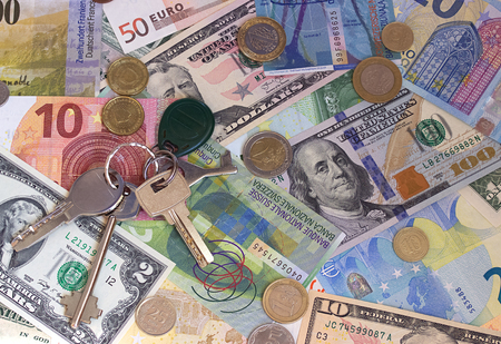 Keys cash and coins abstract money backgroundの写真素材