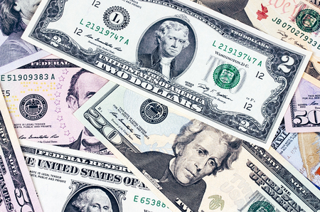Abstract american dollar bills of different denomination backgroundの写真素材