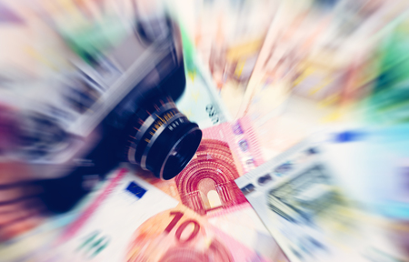 Euro money of different denominations and vintage camera blured backgroundの写真素材