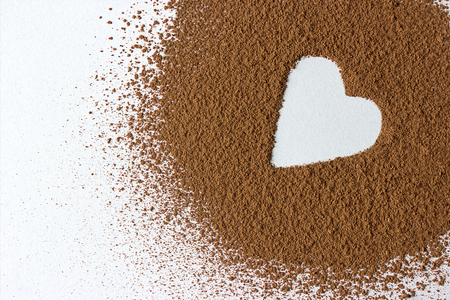 Valentine day backround heart shape cocoa powder isolated on whiteの写真素材